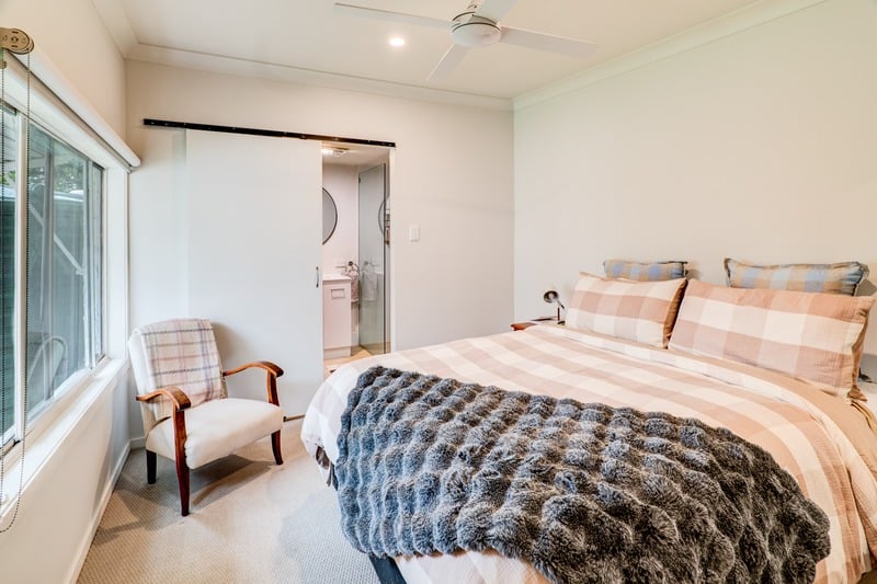 Guesthouse bedroom with plaid bedding