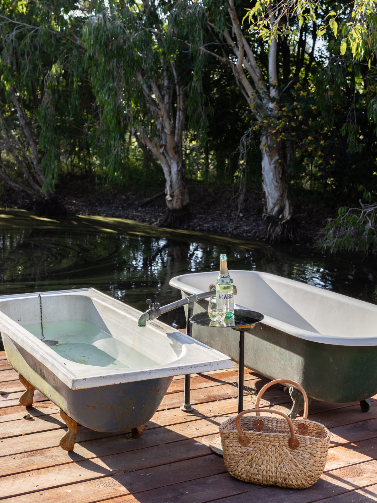 Outdoor baths on the deck beside the dam
